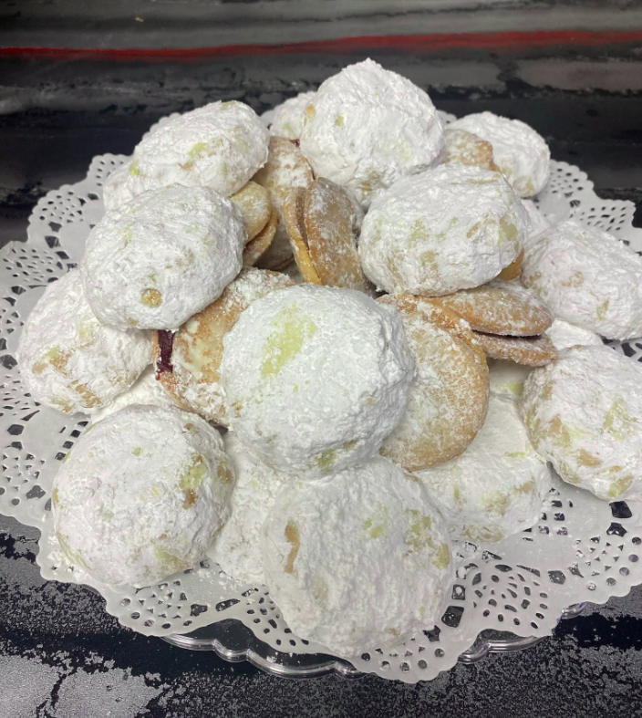 Powdered-sugar cookies on a plate