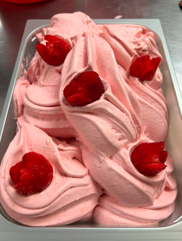 Tray of fresh strawberry gelato topped with sliced strawberries at Armetta's